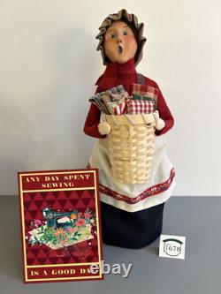 Byers Choice Woman Selling Fabrics a/k/a Holiday Market Joyce withAccessory Sign Byers Choice Woman Selling Fabrics a/k/a Holiday Market Joyce withAccessory Sign