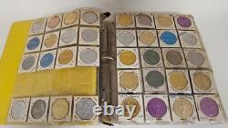 MARDI RAS DOUBLOON ALBUM CONTAINING APPROXIMATELY 273 1960-70's'S VINTAGE COINS