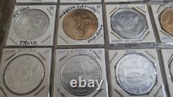 MARDI RAS DOUBLOON ALBUM CONTAINING APPROXIMATELY 273 1960-70's'S VINTAGE COINS