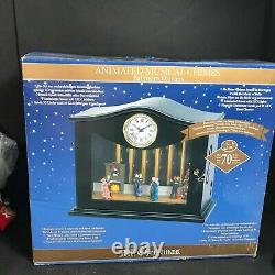 Mr. Christmas Clock with animated chimes and Ballroom dancers plays 70 songs