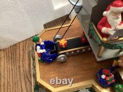 Mr. Christmas. Santa's toy factory. Works great. SEE VIDEO