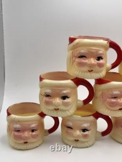 Set of 12 miniature made in Hong Kong Winking Santa plastic mugs Set of 12 miniature made in Hong Kong Winking Santa plastic mugs
