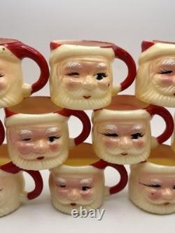 Set of 12 miniature made in Hong Kong Winking Santa plastic mugs Set of 12 miniature made in Hong Kong Winking Santa plastic mugs