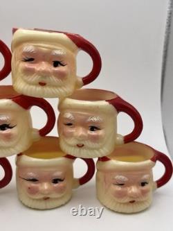 Set of 12 miniature made in Hong Kong Winking Santa plastic mugs Set of 12 miniature made in Hong Kong Winking Santa plastic mugs