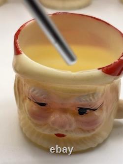 Set of 12 miniature made in Hong Kong Winking Santa plastic mugs Set of 12 miniature made in Hong Kong Winking Santa plastic mugs