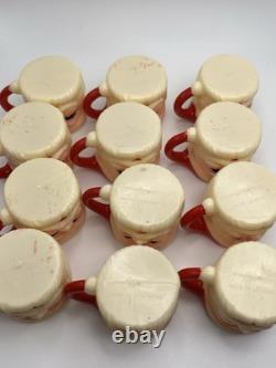 Set of 12 miniature made in Hong Kong Winking Santa plastic mugs Set of 12 miniature made in Hong Kong Winking Santa plastic mugs