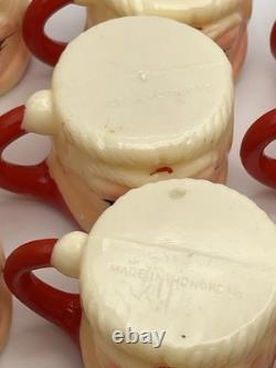 Set of 12 miniature made in Hong Kong Winking Santa plastic mugs Set of 12 miniature made in Hong Kong Winking Santa plastic mugs