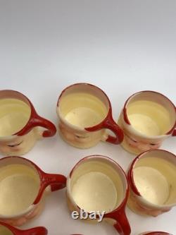 Set of 12 miniature made in Hong Kong Winking Santa plastic mugs Set of 12 miniature made in Hong Kong Winking Santa plastic mugs