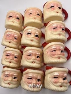Set of 12 miniature made in Hong Kong Winking Santa plastic mugs Set of 12 miniature made in Hong Kong Winking Santa plastic mugs