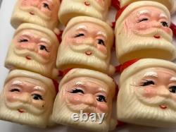 Set of 12 miniature made in Hong Kong Winking Santa plastic mugs Set of 12 miniature made in Hong Kong Winking Santa plastic mugs