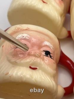 Set of 12 miniature made in Hong Kong Winking Santa plastic mugs Set of 12 miniature made in Hong Kong Winking Santa plastic mugs