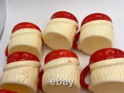 Set of 12 miniature made in Hong Kong Winking Santa plastic mugs Set of 12 miniature made in Hong Kong Winking Santa plastic mugs