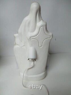 Vintage General Foam Halloween Blow Mold Light Skeleton in front of Tombstone