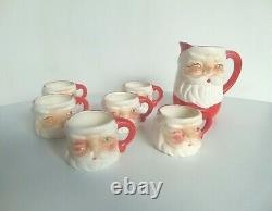 Vintage gemstone santa pitcher & 6 winking santa mugs