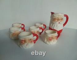 Vintage gemstone santa pitcher & 6 winking santa mugs